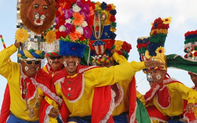 Dancers and a colourful float at the Barranquilla Carnival