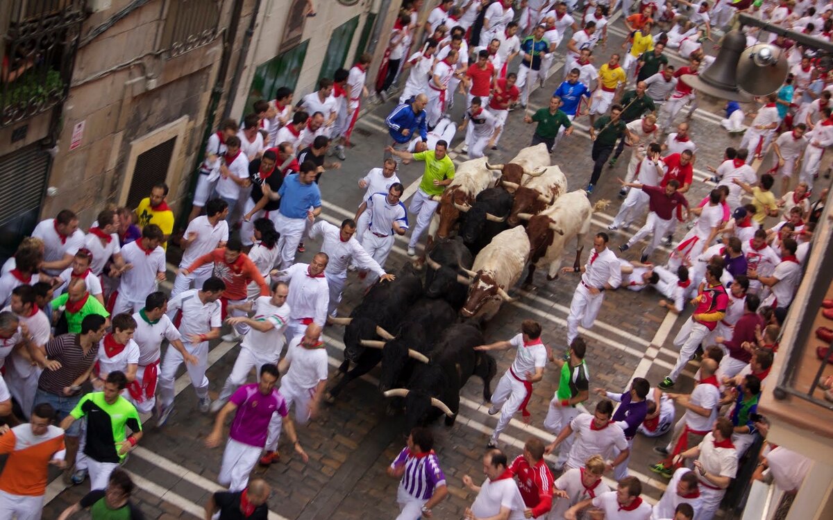 The running of the bulls on Estafeta Street in Pamplona during San Fermín